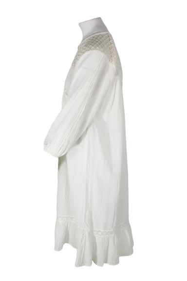 side angle vintage ivory three-quarter sleeve midi dress on feminine mannequin featuring crochet upper, elastic cuffs, and roomy fit. 