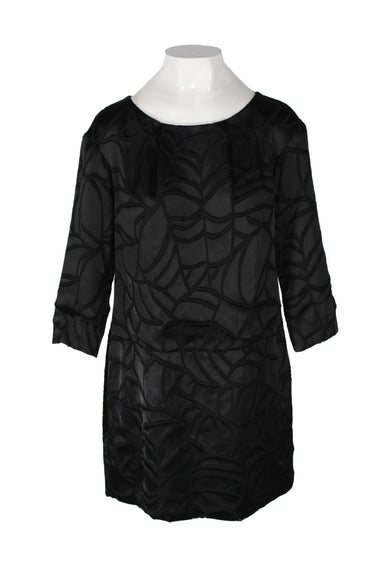 front of thakoon black mini dress. features abstract design, rounded neckline, 3/4 sleeves, slightly loose at waist, and straight length.