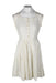  front of vintage off white short sleeve dress. features square neckline, striped effect throughout, tonal stitching, and gold toned floral buttons at front, and zip closure at left side; a-line fit. 