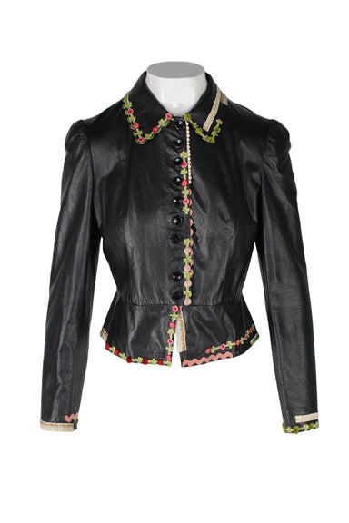description: vintage moschino cheap and chic black leather floral jacket. features pink and green tones floral trim throughout, button closure at center front, and fitted style. 