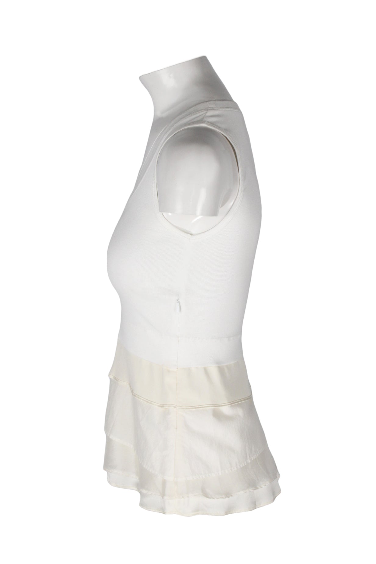 side angle brunello cucinelli knit tank on feminine mannequin torso featuring tiered lower panels and invisible side zip closure.