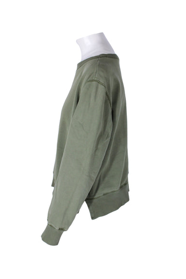 side angle alex mill sage green sweatshirt on feminine mannequin torso featuring slit side seams.
