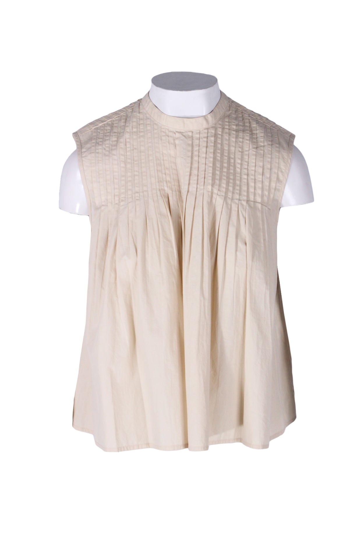 front angle deveaux new york beige sleeveless cotton top on feminine mannequin torso featuring pleated upper, round neckline, and loose fit. 