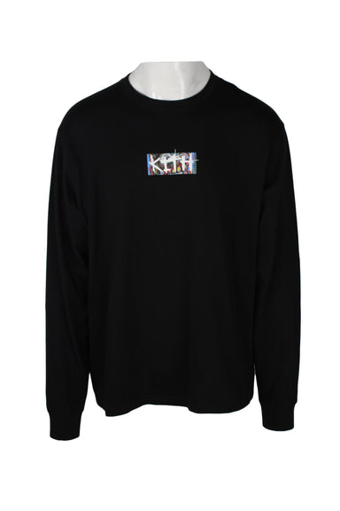 front angle of kith black long sleeve t-shirt. features small rectangle with branded text 'kith' in raised white ink on colorful background. rounded ribbed collar/cuffs. 
