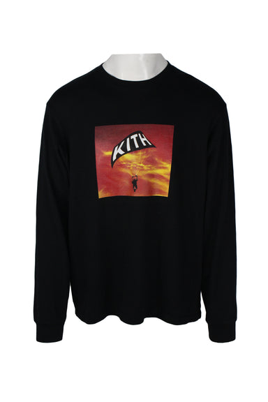 kith black long sleeve graphic t-shirt. features square screen print in red/yellow of parachuter with text 'kith' on parachute, mid weight cotton fabric, high rounded ribbed collar/cuffs. 
