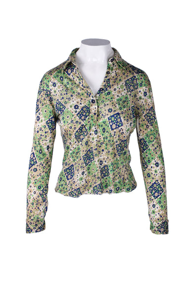 front angle of vintage green and blue diamond floral shirt on fem mannequin torso. features long sleeves with buttoned cuffs, buttoned half placket, pointed collar, and all over floral diamond patterned print throughout. 