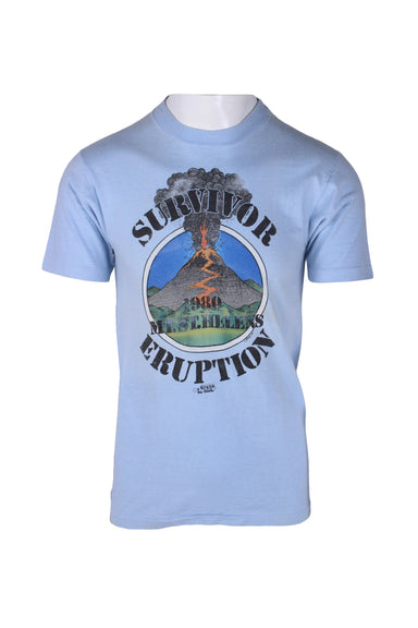 front view of vintage 80’s hanes beefy-t light blue cotton t-shirt. features ‘survivor 1980 mt.st.helens eruption. j.bates.80. super shirts. ’ graphic printed at front with ribbed collar.