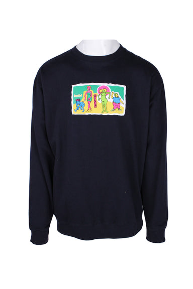 front angle of  krooked navy pullover sweatshirt. features ‘krooked gonzales’ graphic printed at front with ribbed collar/cuffs/hem.