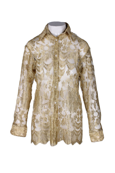 front angle of vintage le garage gold sheer lace blouse. features long sleeves, button closure up center, buttoned cuffs, sheer mesh fabric throughout, pointed collar, and scalloped hem.  
