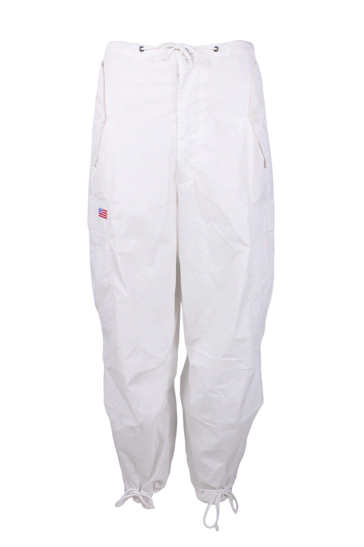 description: vintage ufo white cargo pants. features button with drawstring closure at waist, zip flu, drawstring detailing at bottom hem, and multiple pockets throughout. 