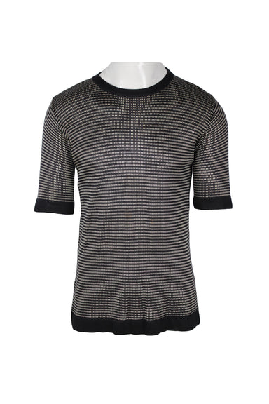 front angle of arkun black and white knit short sleeve shirt. features solid black ribbed collar/cuffs/hem, striped horizontal knit pattern, and pull-over fit. 