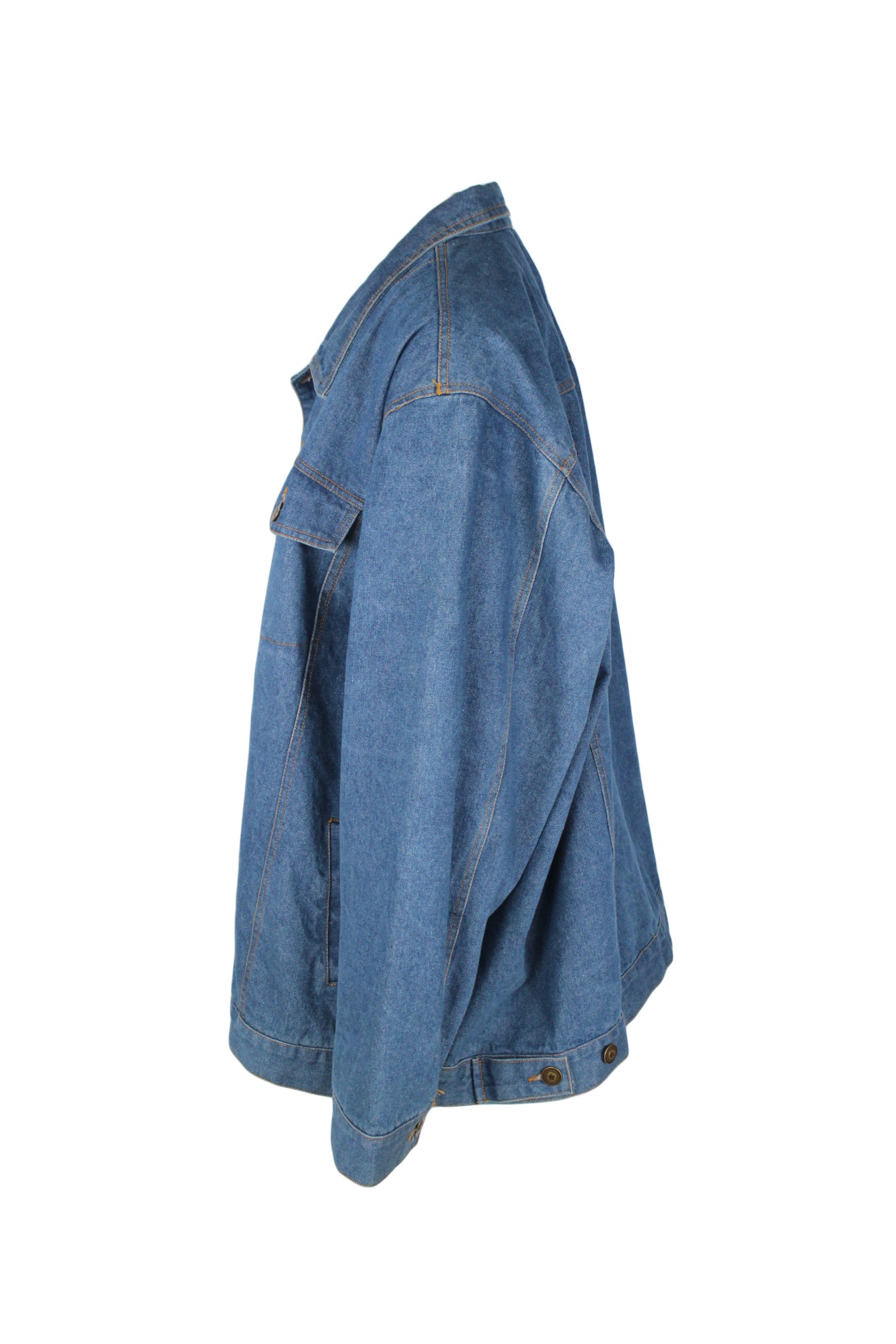 side angle of denim jacket. features adjustable button hem. 