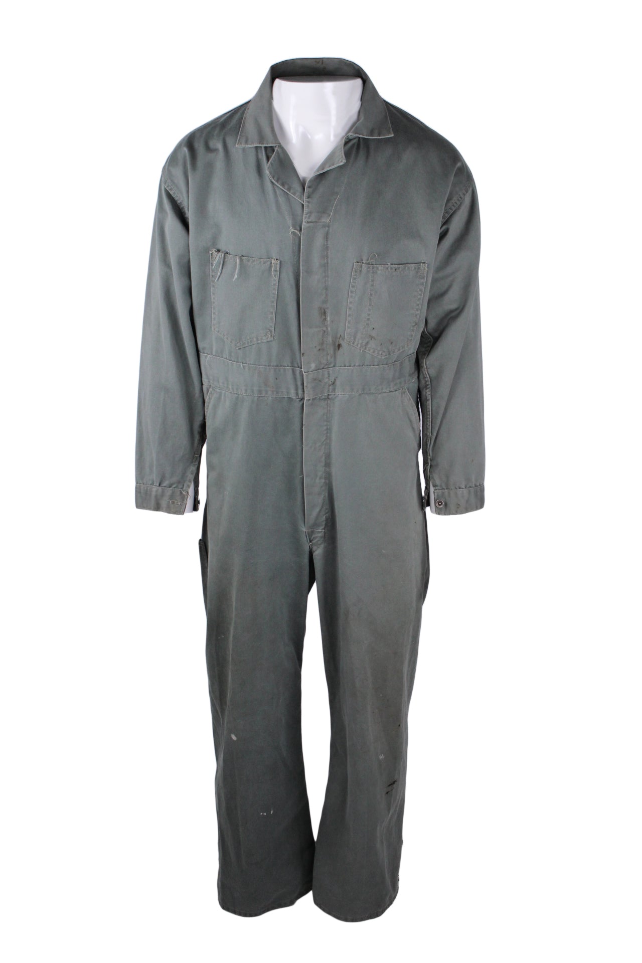 front view of vintage 40’s/50’s faded lincoln green button up coveralls. features double breasted pockets, side hand pockets, side holes to reach within, right rear pocket, and buttons at cuffs.