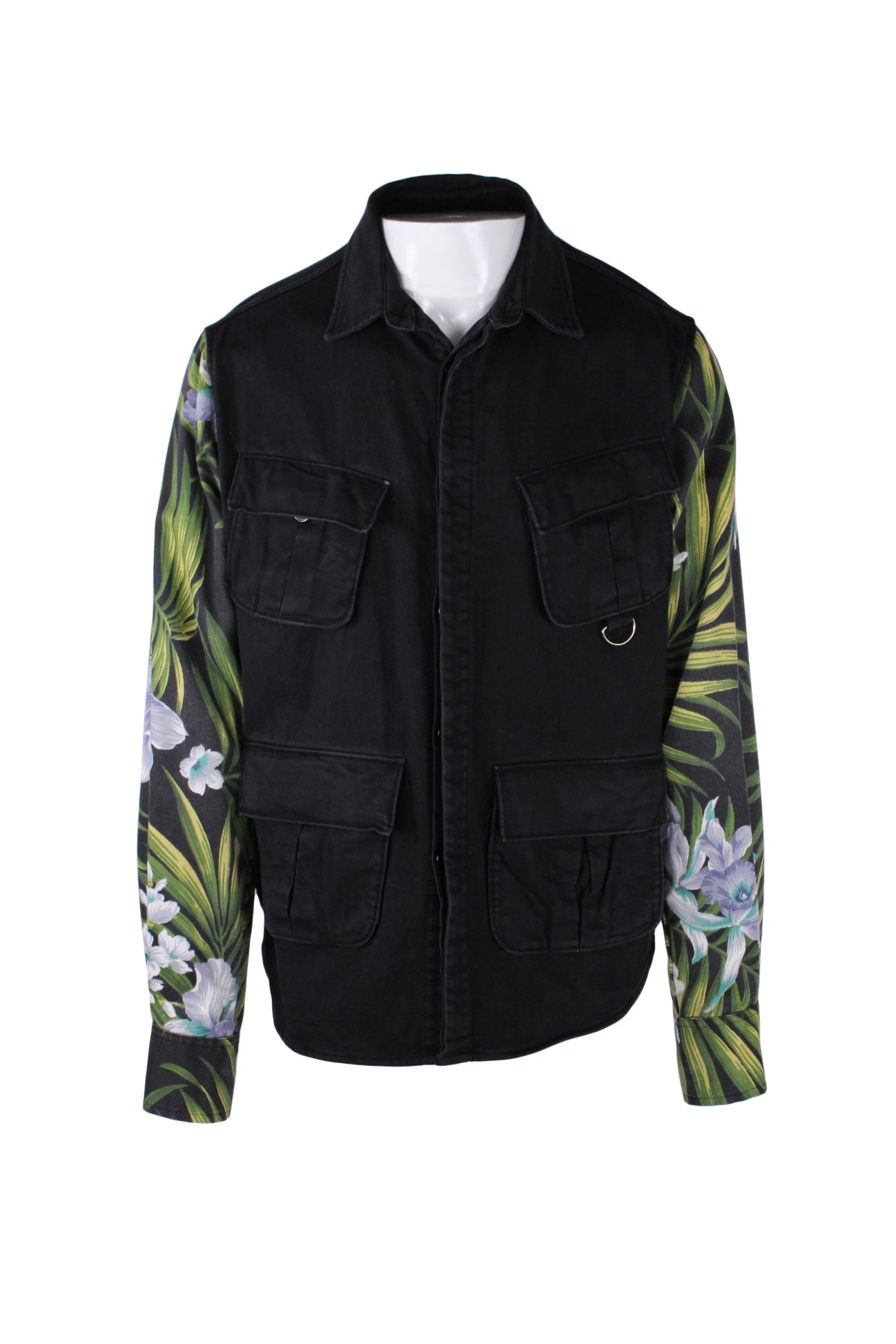 front view of kith black/green tropical button up denim jacket. features double breasted button flap pockets, front button flap pockets above hem, and tropical pattern sleeve with buttons at cuffs.