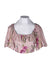 front angle yumi kim dusty pink/multicolor floral print crop top on feminine mannequin torso featuring short puff sleeves and ruffled scoop neckline.