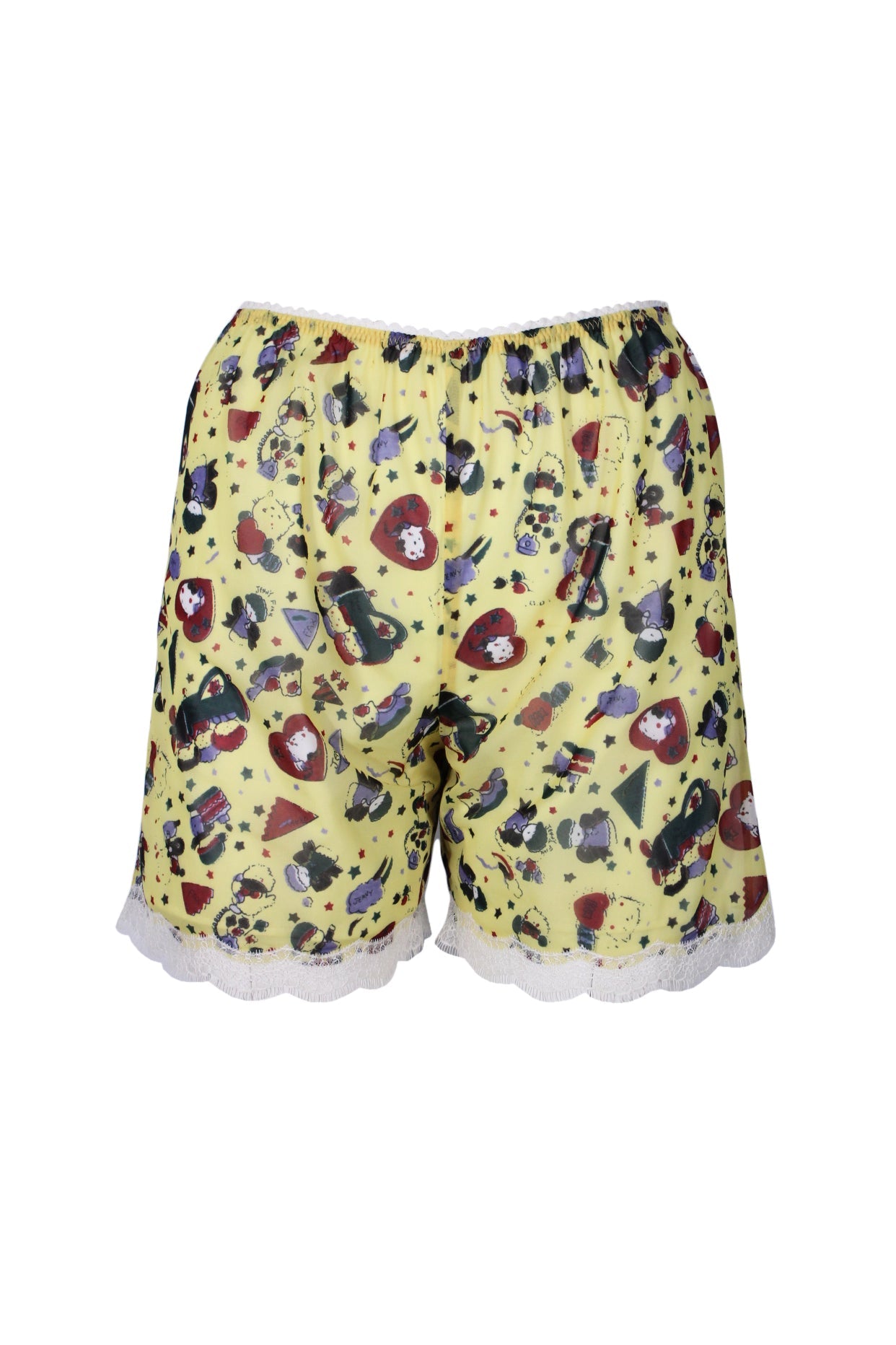 front angle mikio sakabe jenny fax yellow/multicolor shorts. featuring semi-sheer main with illustration/'jenny fax' print throughout, elastic waist with zig-zag trim, and lace-embellished hem.