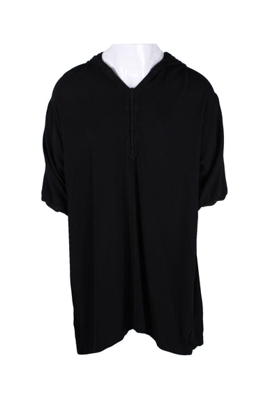 front angle of kounouz lux black long tunic. features short sleeves, v-neckline, hood, decorative button half placket, with black cord trim. 