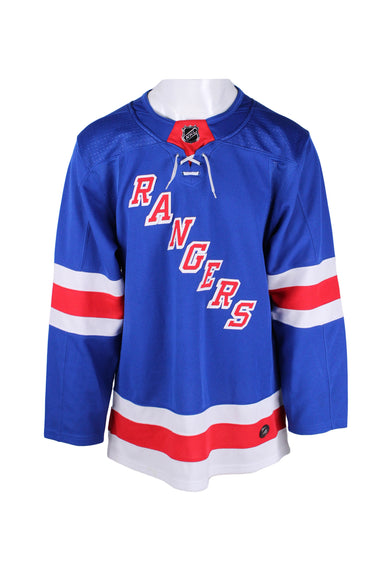 front angle of adidas blue rangers jersey. features white and red stripes mid arm/at hem, branded 'nhl' crest at high rounded collar, small drawstring below collar, 'rangers' in red bold diagonal down front, and long sleeves.