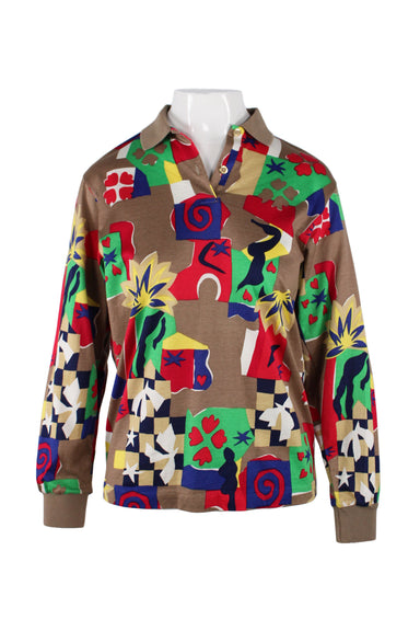 front of evanova golf brown cotton long sleeve shirt. features multicolor abstract print throughout, spread collar, gold tone button at neck, ribbed trim, and pull on style.  