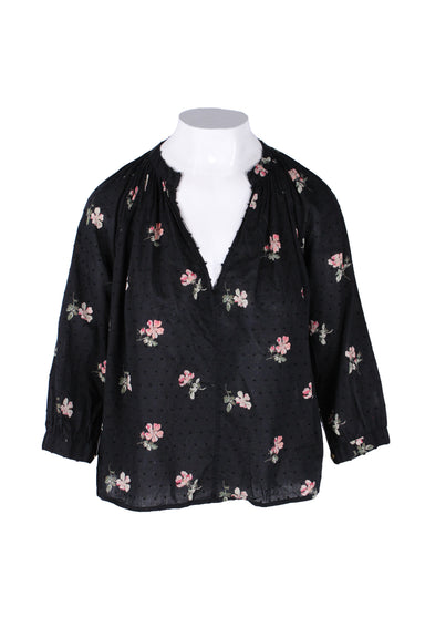 front angle of ulla johnson for barneys new york black cherry blossom light cotton blouse on fem mannequin torso. features geometric tufted fabric, ruching at v-neckline, three quarter buttoned sleeves, and semi-sheer cherry blossom print fabric. 