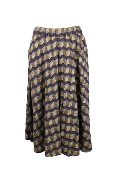 front of  ace&jig gold and navy midi skirt. features zig zag design throughout, elasticized waist, side seam pockets, knee length, and pull on style.