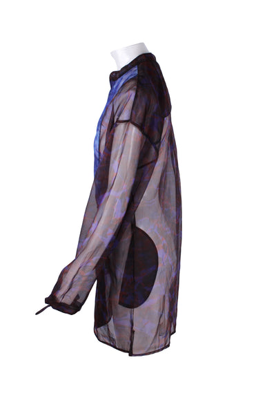 profile of shirt with long sleeve and slit at sides. 