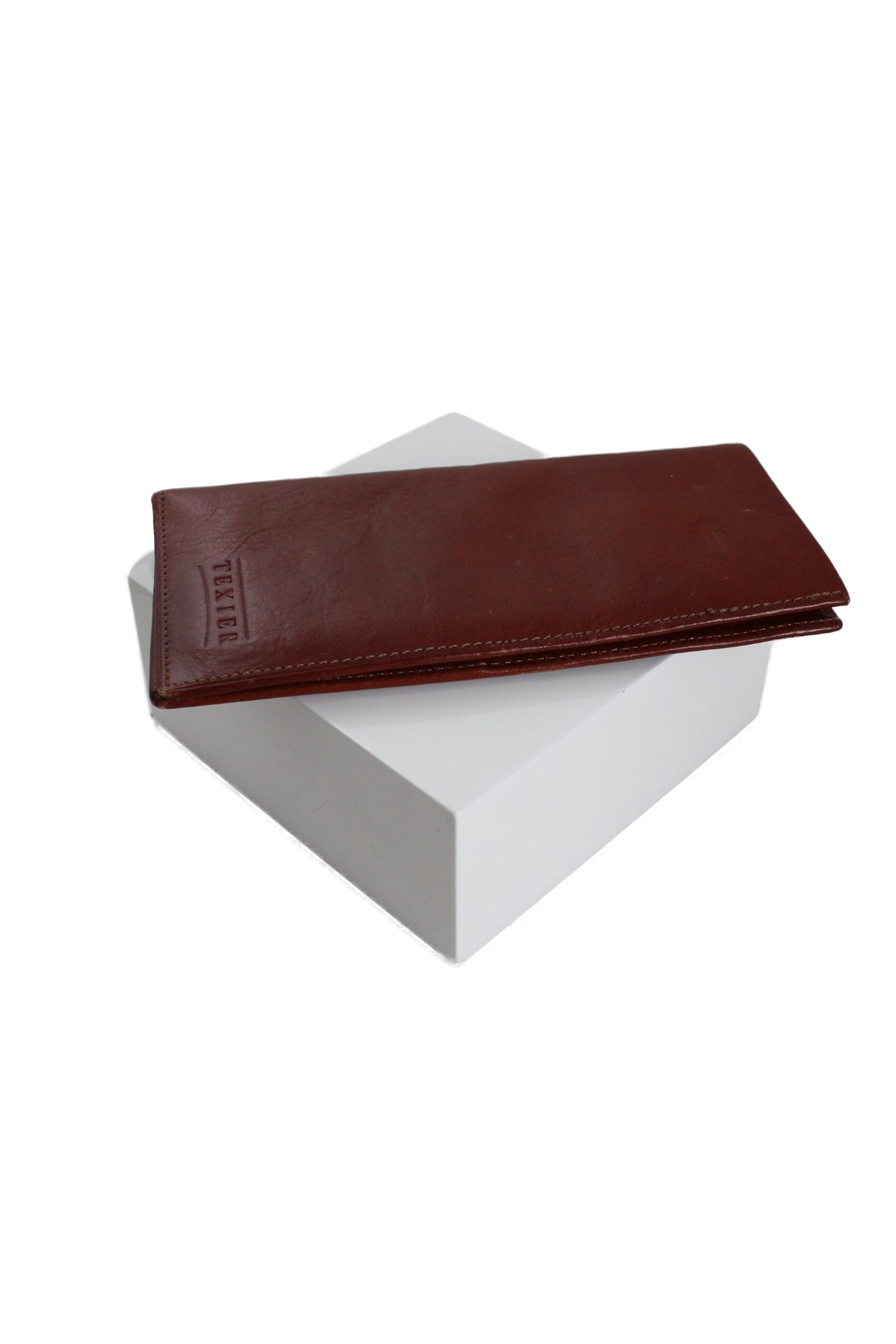 upper angle of texier brown leather bill fold. features many card holder slots, two larger slit pockets, and debossed branding on bottom right. 
