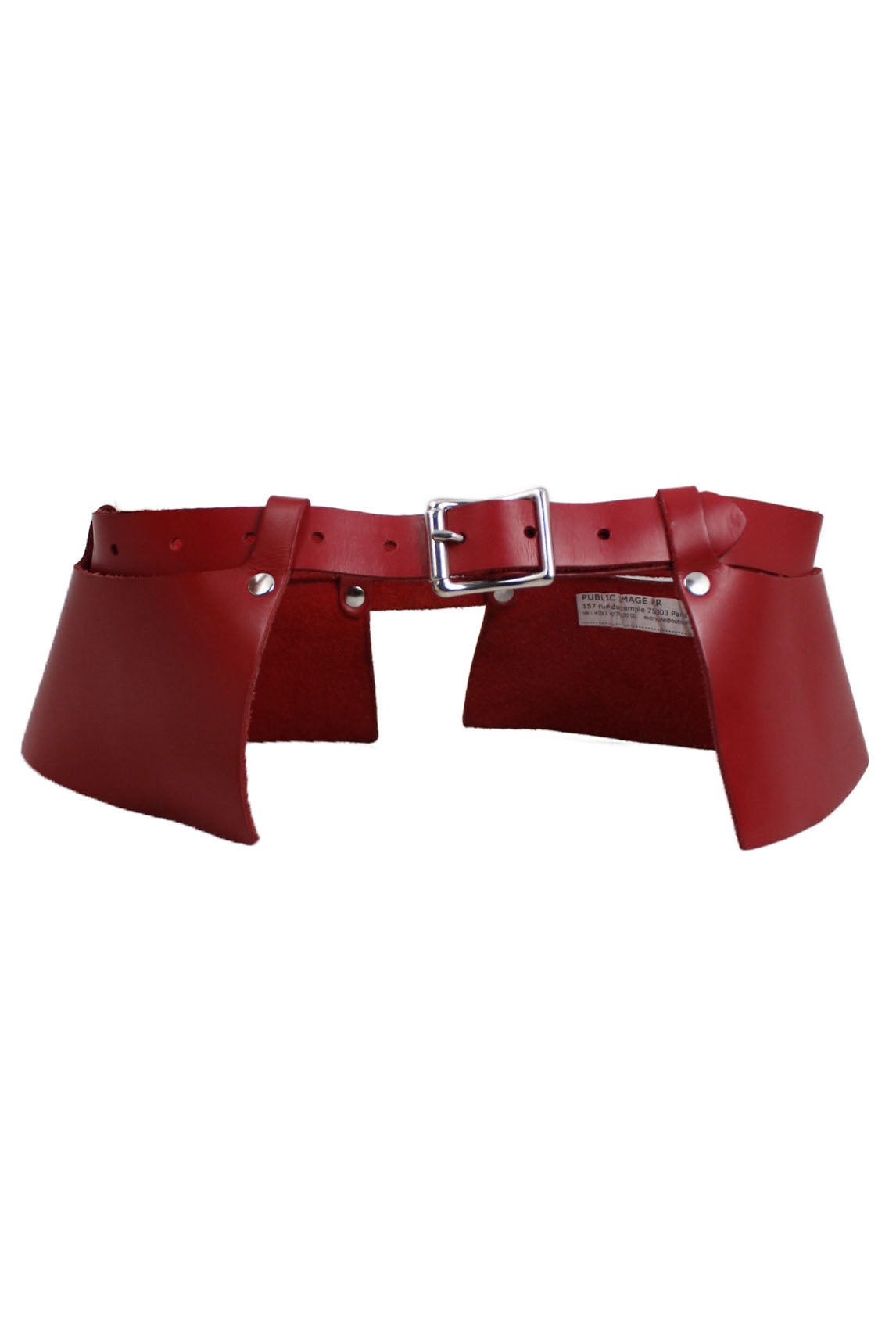 zana bayne public image pr red leather belt. features 2 side panels that flare out on the side and are attached with loops and metal studs. silver buckle as closure