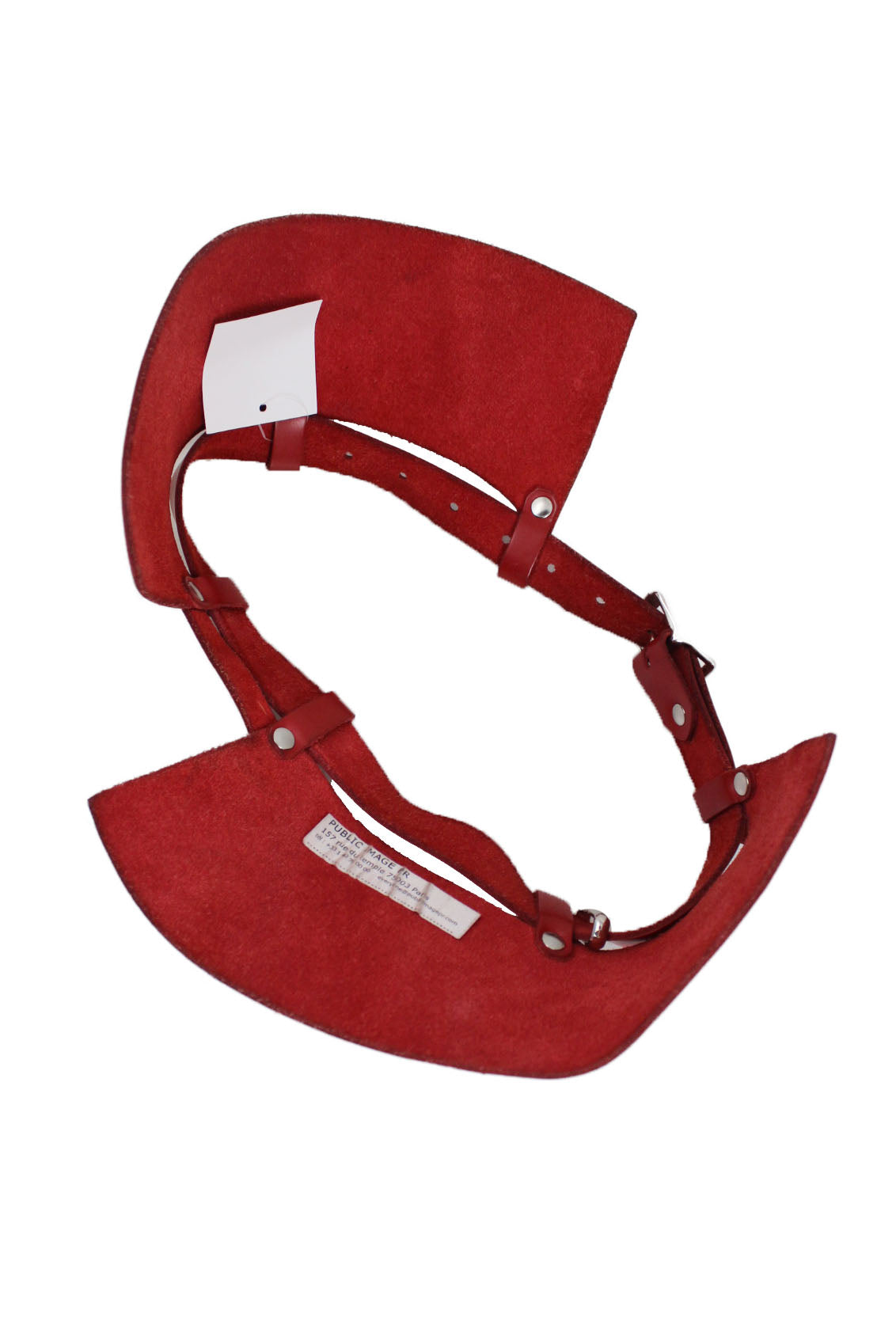 zana bayne public image pr red leather belt. features 2 side panels that flare out on the side and are attached with loops and metal studs. silver buckle as closure