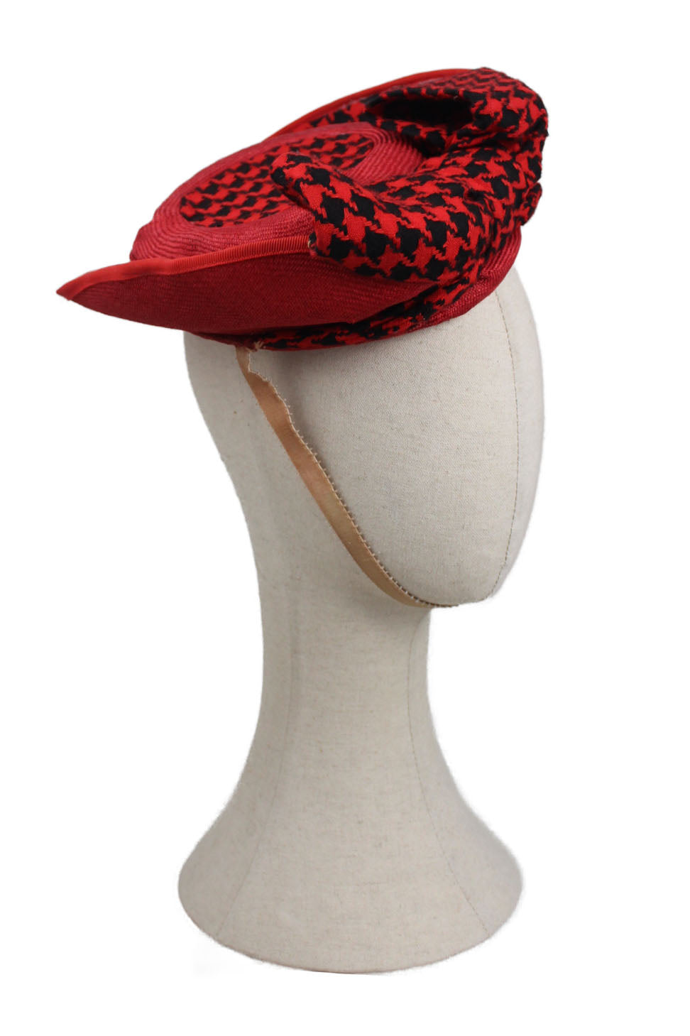 vintage rodney gordon red hat. features theatre piece with curved base and metal lining, 40's inspired design. houndstooth print and red knit. features beige ribbon for neck and plastic comb inside