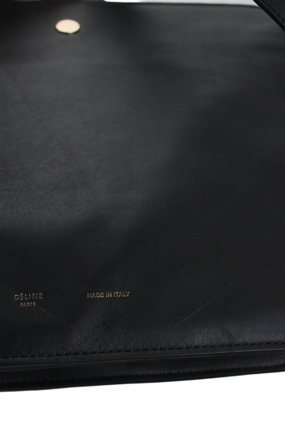 photo detail of bag. showing minor scratch.    