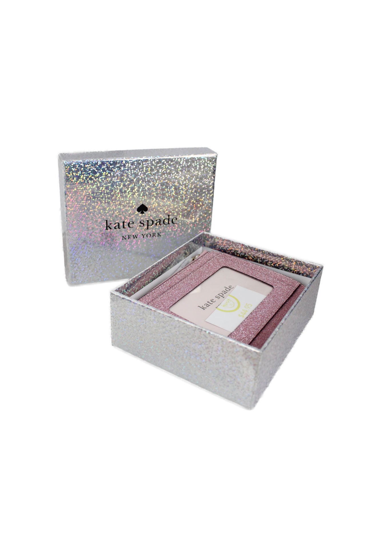 box view of kate spade pink ‘lola glitter’ small l-zip bifold wallet. features branding & l-zip compartment, interior 6-card slots, back clear window id compartment, metal pinmount with spade logo,  magnetic snap closure, bill fold, zip around coin compartment