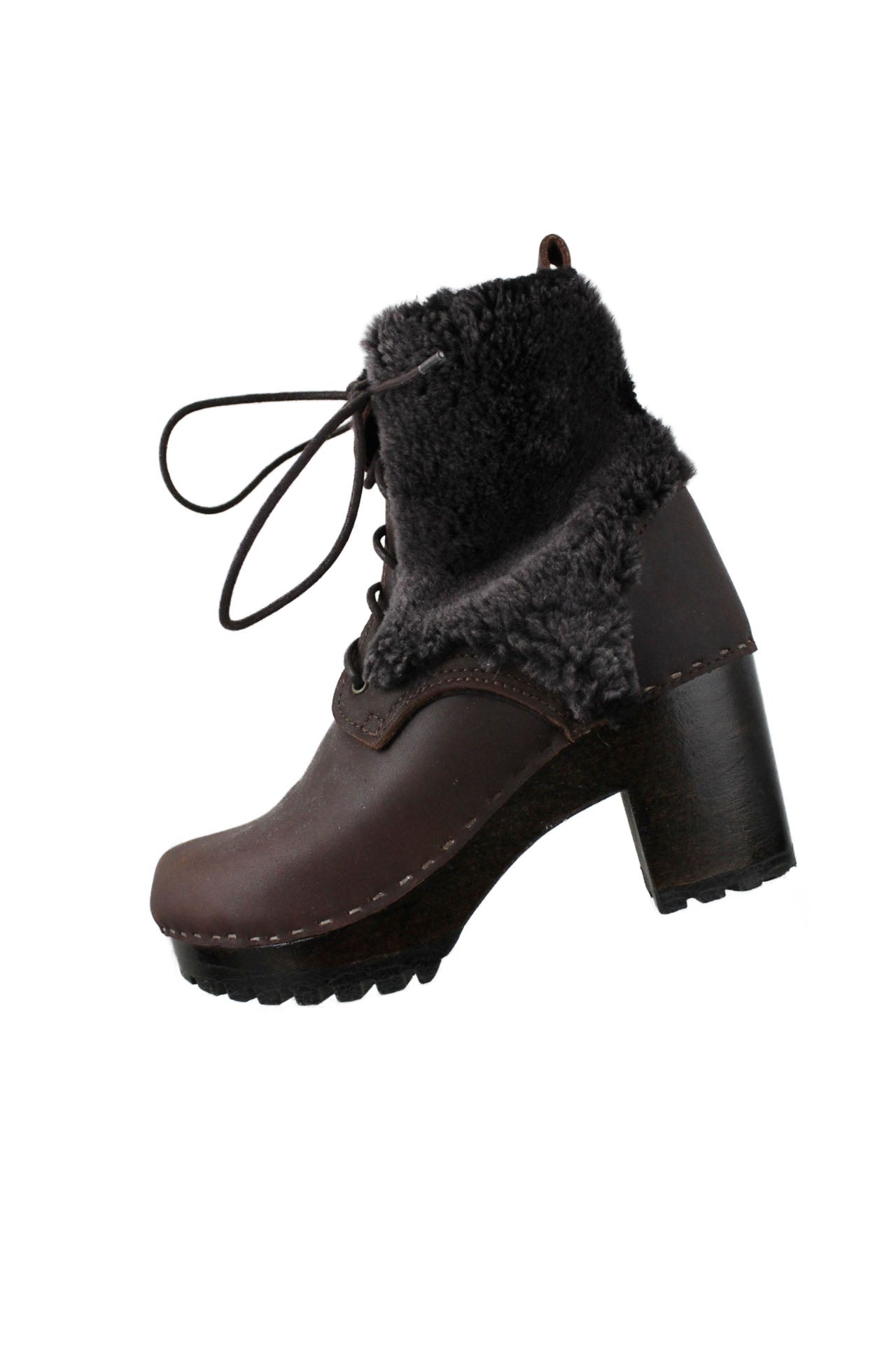 profile of unlabeled brown fur ankle boots. features rounded toe,  fur detail at top, blocked heels, and lace up closure. 