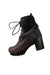 profile of unlabeled brown fur ankle boots. features rounded toe,  fur detail at top, blocked heels, and lace up closure. 