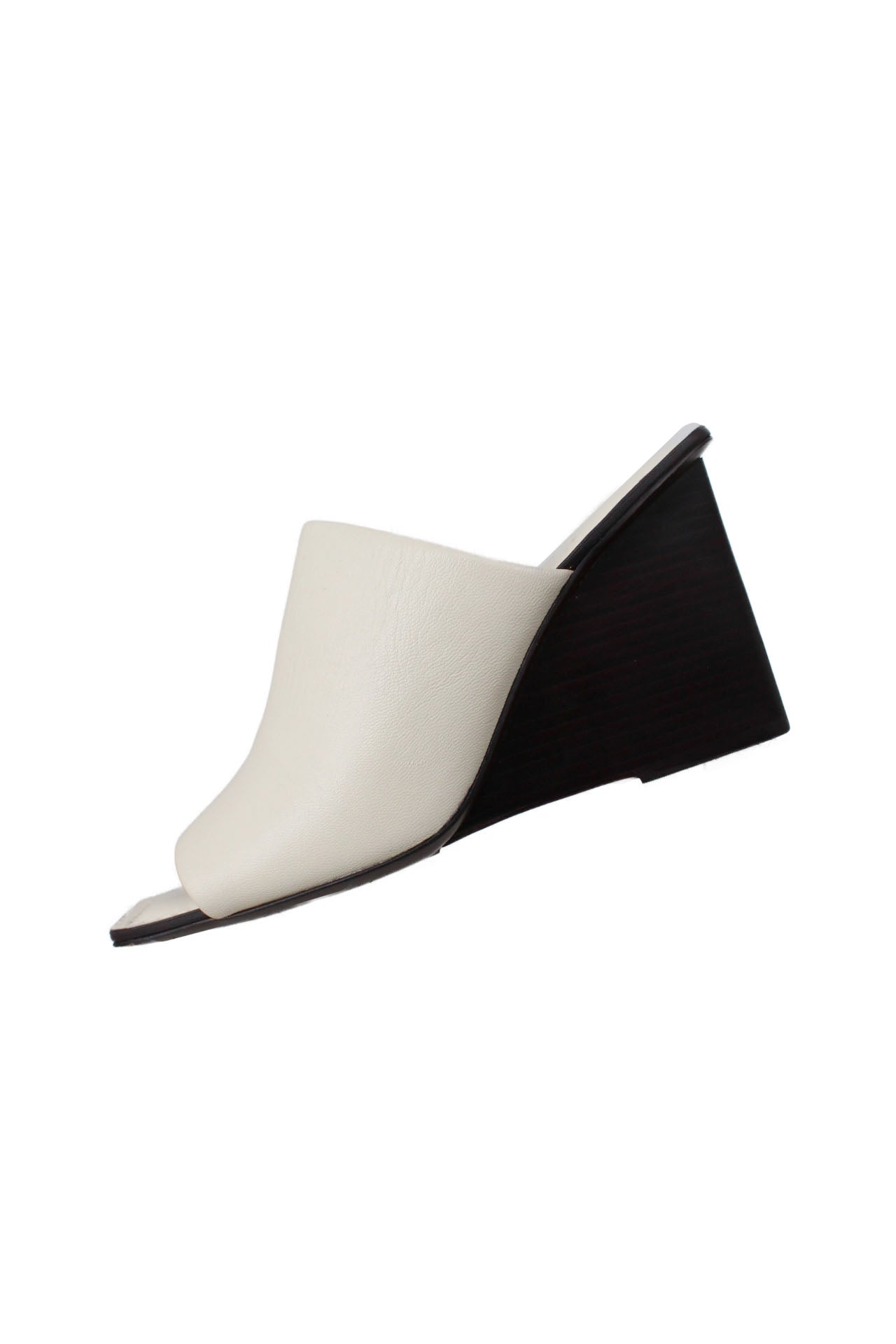 description: mercedes castillo white leather mules. features square toe silhouette, slip on style, and black heel. 