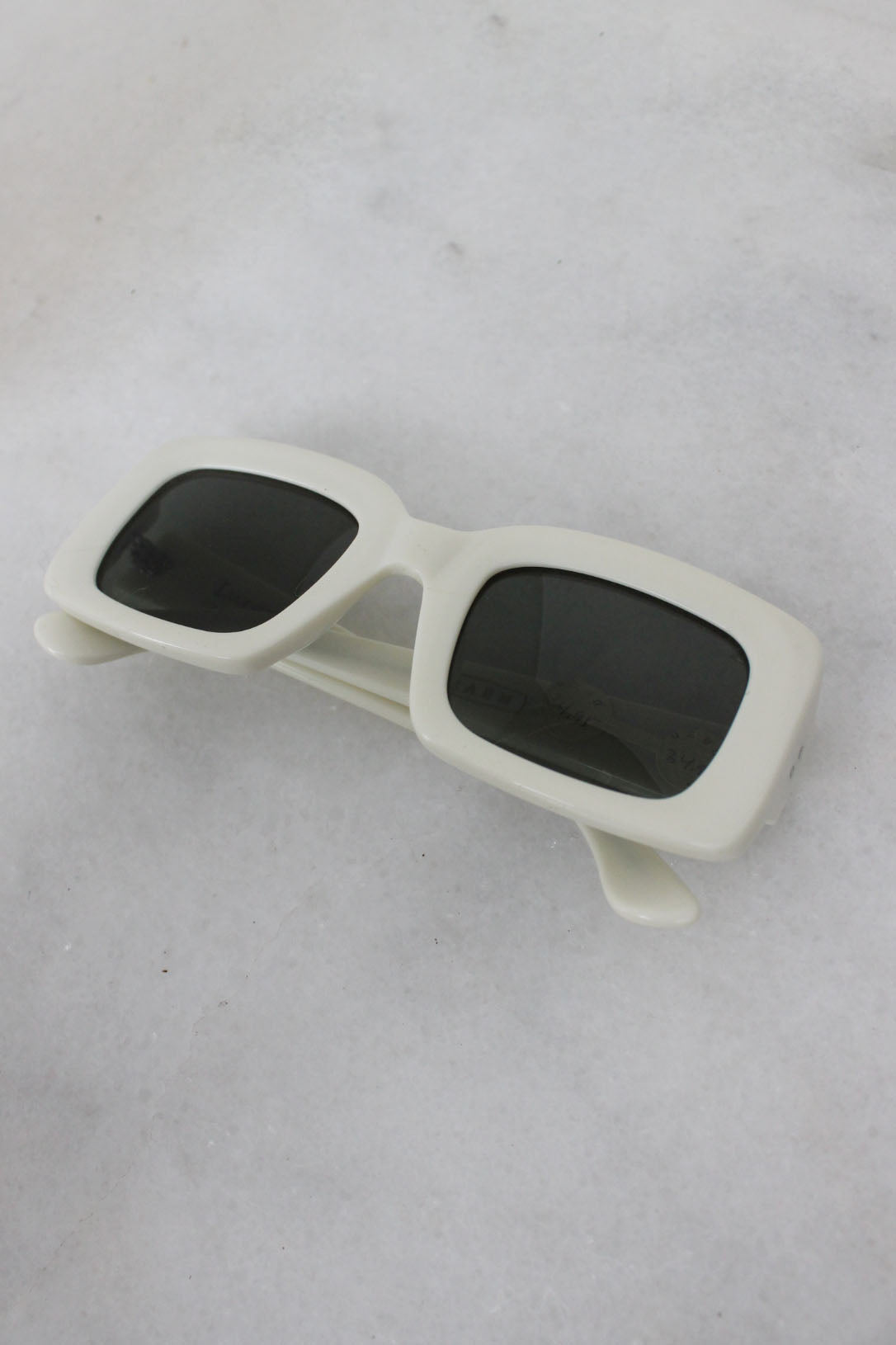 above angle of folded sunglasses. 