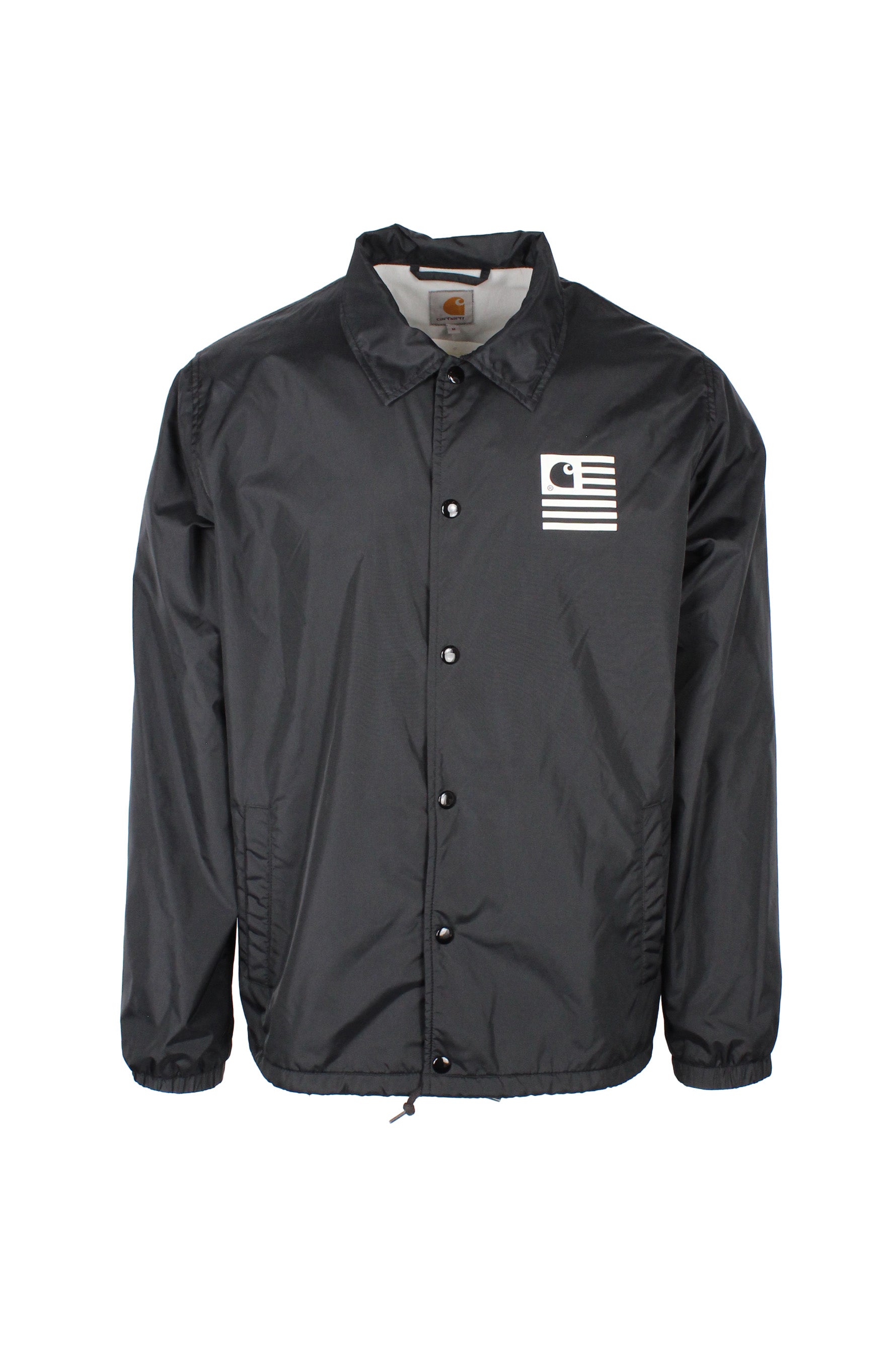 front view of carhartt wip black snap button up ‘state’ coach jacket. features carhartt ‘c’ state logo printed at left breast, side hand pockets, fully lined, elastic at cuffs, and drawstring at waist.