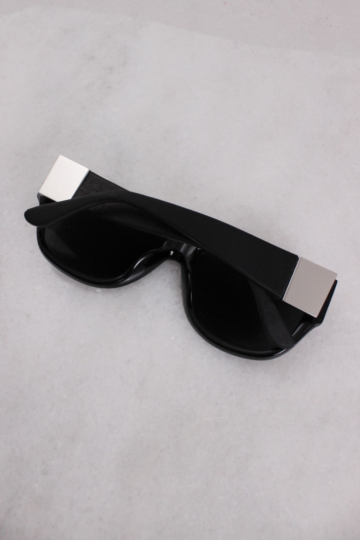 closed arm angle of black sunglasses. 