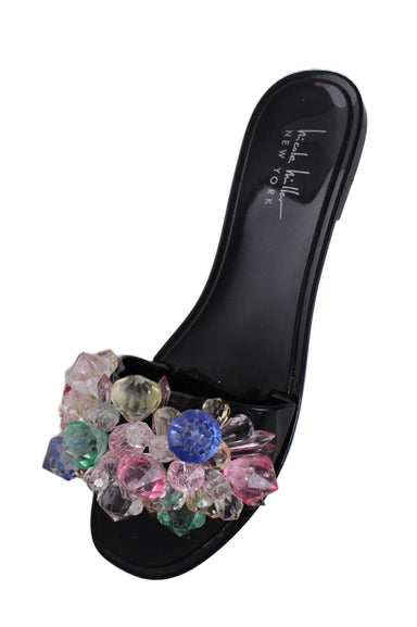 above three-quarter angle nicole miller black sandals featuring bead embellishment and squared toe.