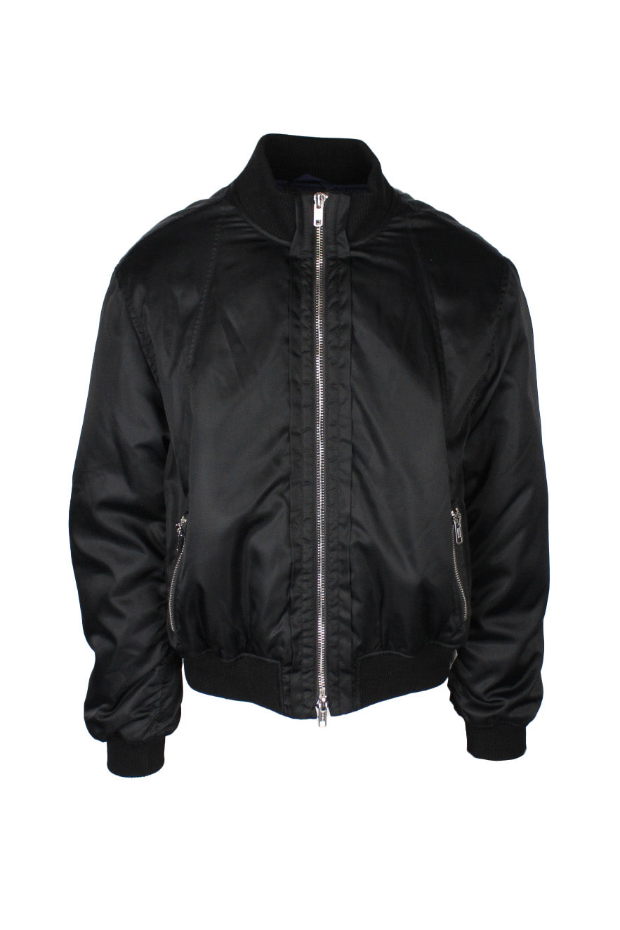 front view of 3.1 phillip lim black two way zip up bomber jacket. features side zip hand pockets, fully lined, ribbed collar/cuffs/hem, and snap sherpa liner vest face.