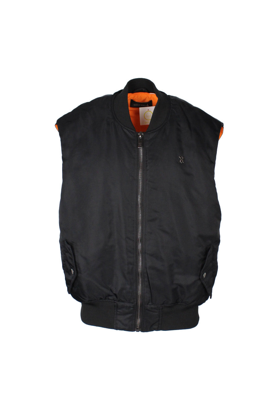 front view of daily paper black zip up puffer vest. features metal logo tag at left breast, side snap flap hand pockets, inner snap chest pocket, and ribbed collar/hem.