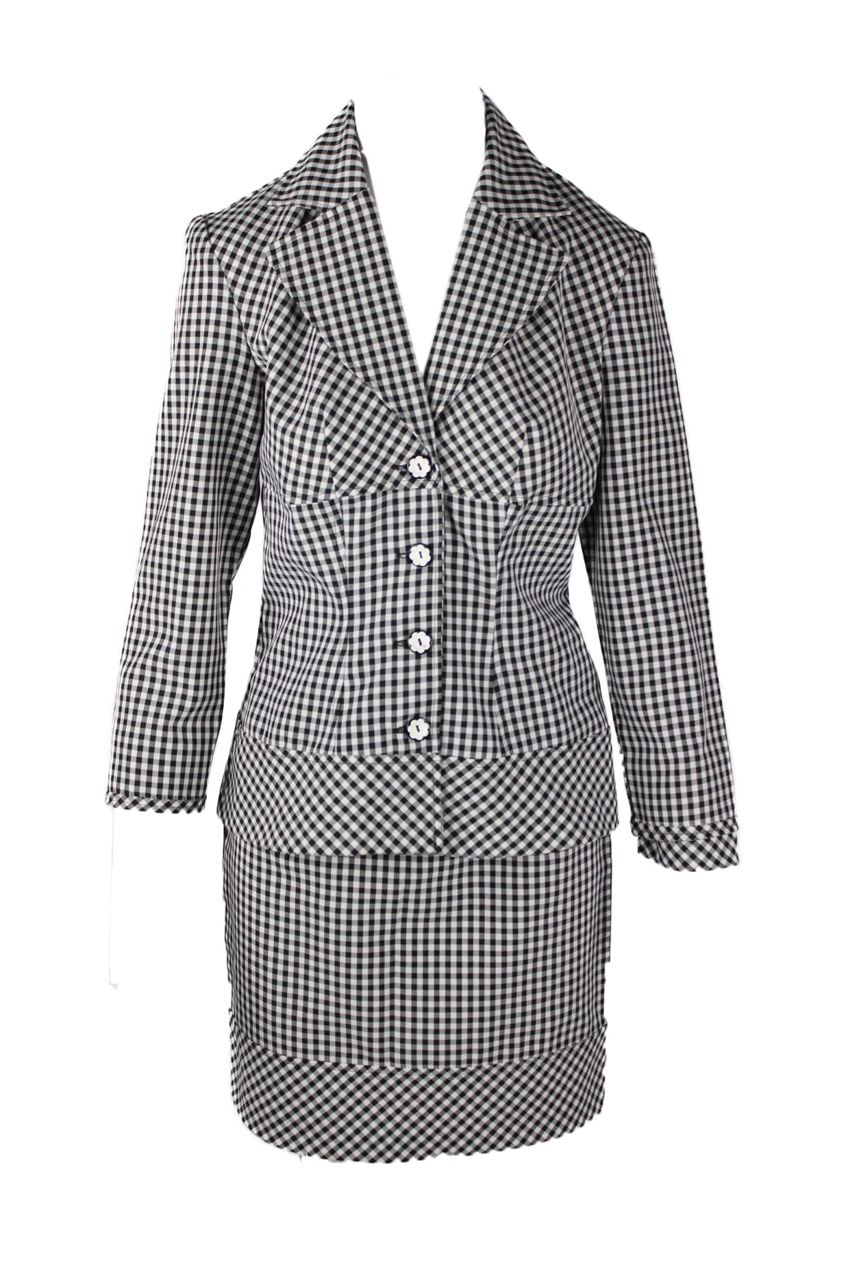 description: vintage 90's black and white gingham print two piece set. features long sleeve blazer with single breasted floral design button closure at center front, and lapel collar, fitted skirt with zipper closure at back. 