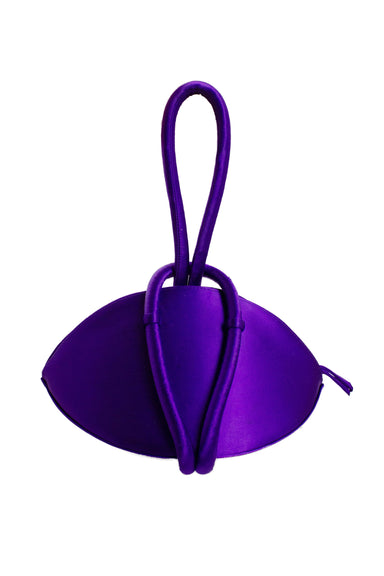 description: kara purple satin conceptual bag. features top zipper closure, and strap loop closure. 