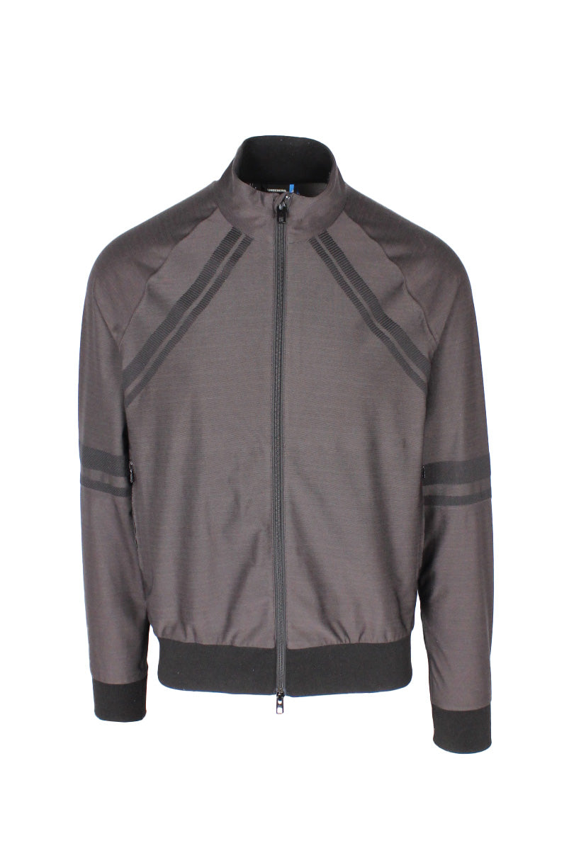 front view of j.lindeberg charcoal/black ‘shino-bonded knit softshell’ two way zip up jacket. features accent stripes throughout, logo at back, side zip hand pockets, and ribbed cuffs/hem/inner collar.