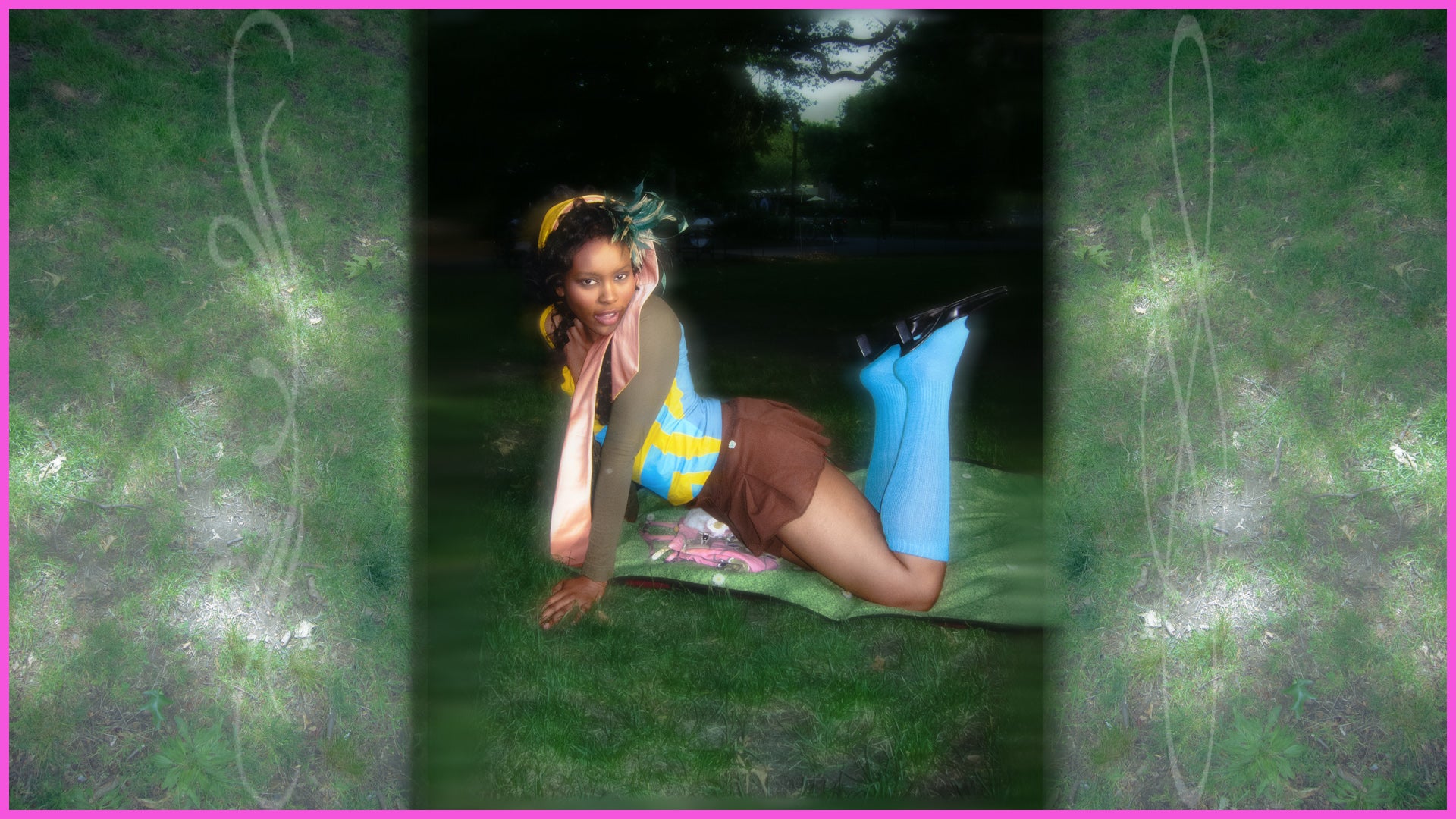Person lying on a mat outdoors with a green and purple border