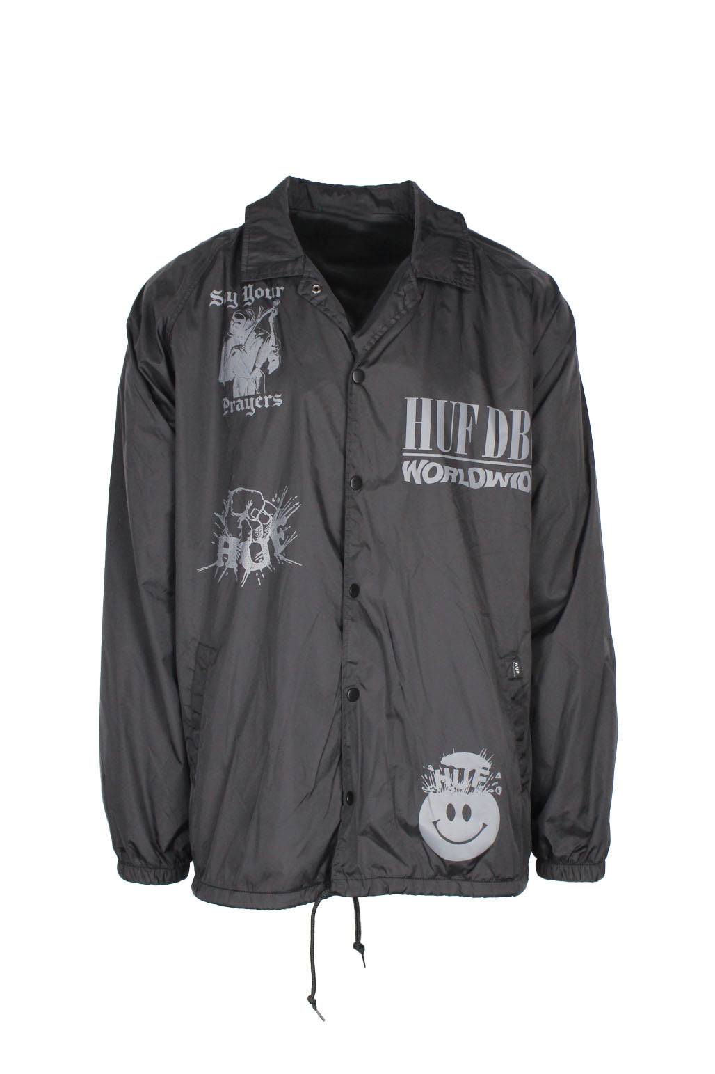 front view of huf black snap button up coach jacket. features ‘huf dbc worldwide. say your prayers.’ graphic logos printed at front/back, side hand pockets, fully lined, elastic at cuffs, and drawstring at hem.