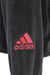 detail view of 'adidas' logo embroidered above left cuff.
