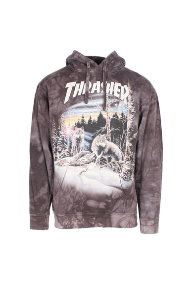 front view of thrasher x the mountain charcoal dyed pullover hoodie. features front kangaroo pouch pocket, drawstrings at hood, ribbed cuffs/hem, ‘thrasher’ logo and ‘find 13 wolves’ graphic printed at front.