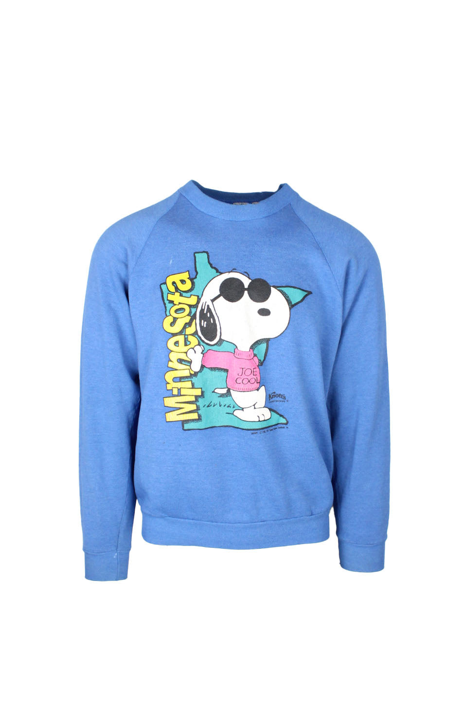 front view of vintage fruit of the loom blue pullover sweatshirt. features ‘minnesota. joe cool. knott’s camp snoopy. snoopy co 1958, 1971.’ graphic printed at chest with ribbed collar/cuffs/hem.