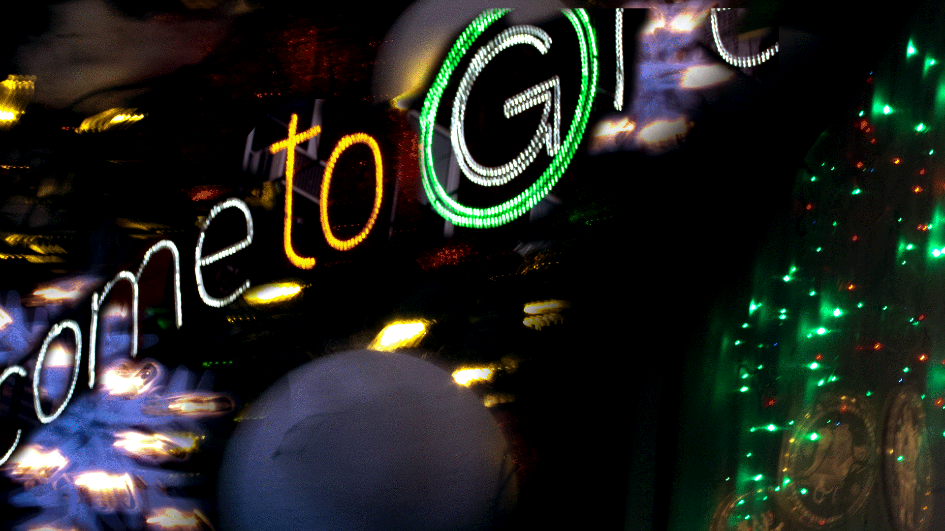 fun animated gif of model in party outfit infront of collage of street holiday lights